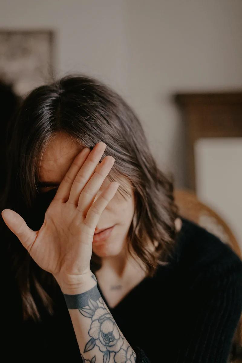 Woman reflecting alone after leaving a toxic relationship